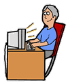 Man at desk typing at computer 