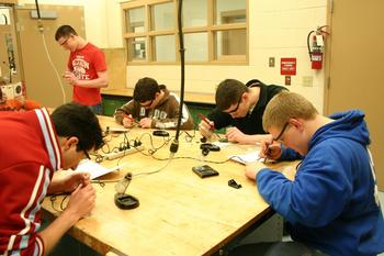 D.E. students working on soldering projects